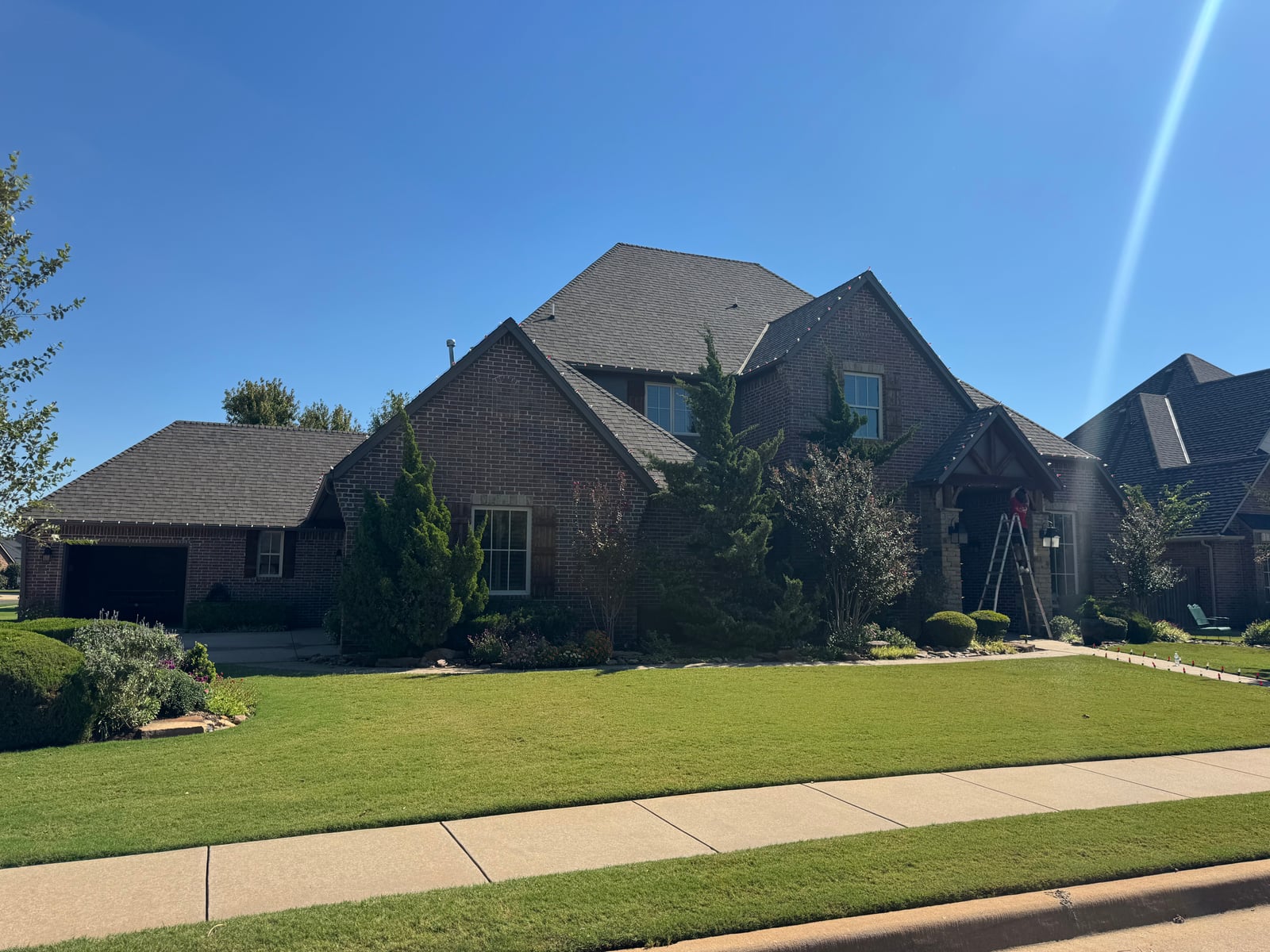 Christmas roofline sidewalk and archway holiday lighting installation