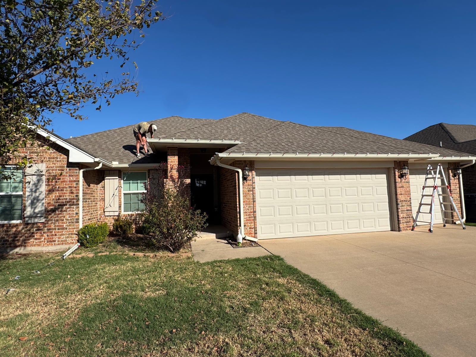 Residential holiday roofline Christmas light installation in Yukon