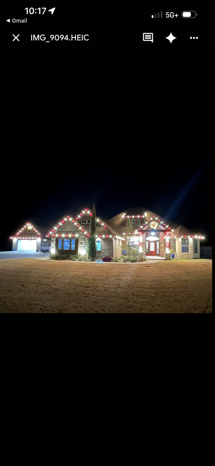 Holiday roofline lighting with wreath and post decorations